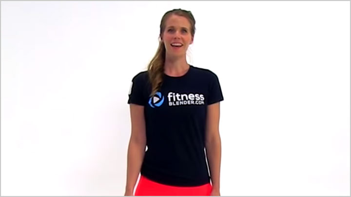 A woman in exercise apparel talking to the camera
