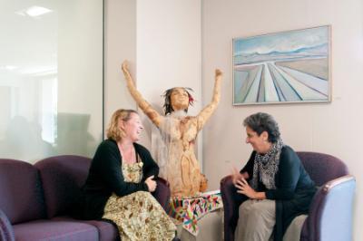 Two LMU members talking in the office